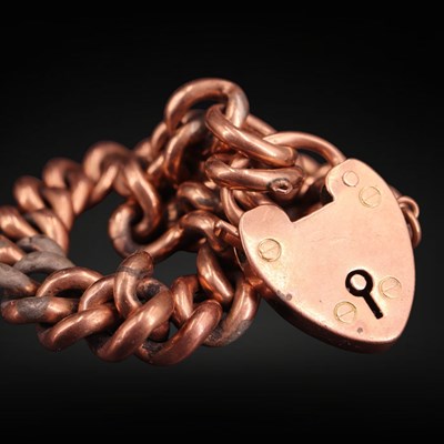 Lot 1308 - A late Victorian 9 ct gold curb link bracelet...