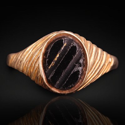 Lot 1251 - A 1980s black onyx and 9 ct gold signet...