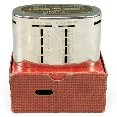 Lot 507 - A Lloyds Bank domestic savings box and...