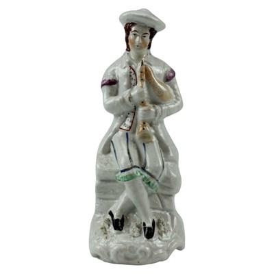 Lot 996 - A Victorian Staffordshire earthenware figurine...