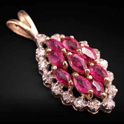 Lot 1325 - A near contemporary ruby and 9 ct gold pendant,...