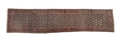 Lot 1432 - A vintage Persian wool runner, approx 3.9 m x...