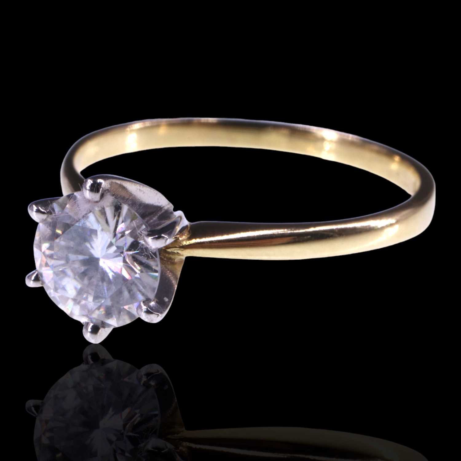 Lot 1153 - A solitaire diamond ring, comprising a...